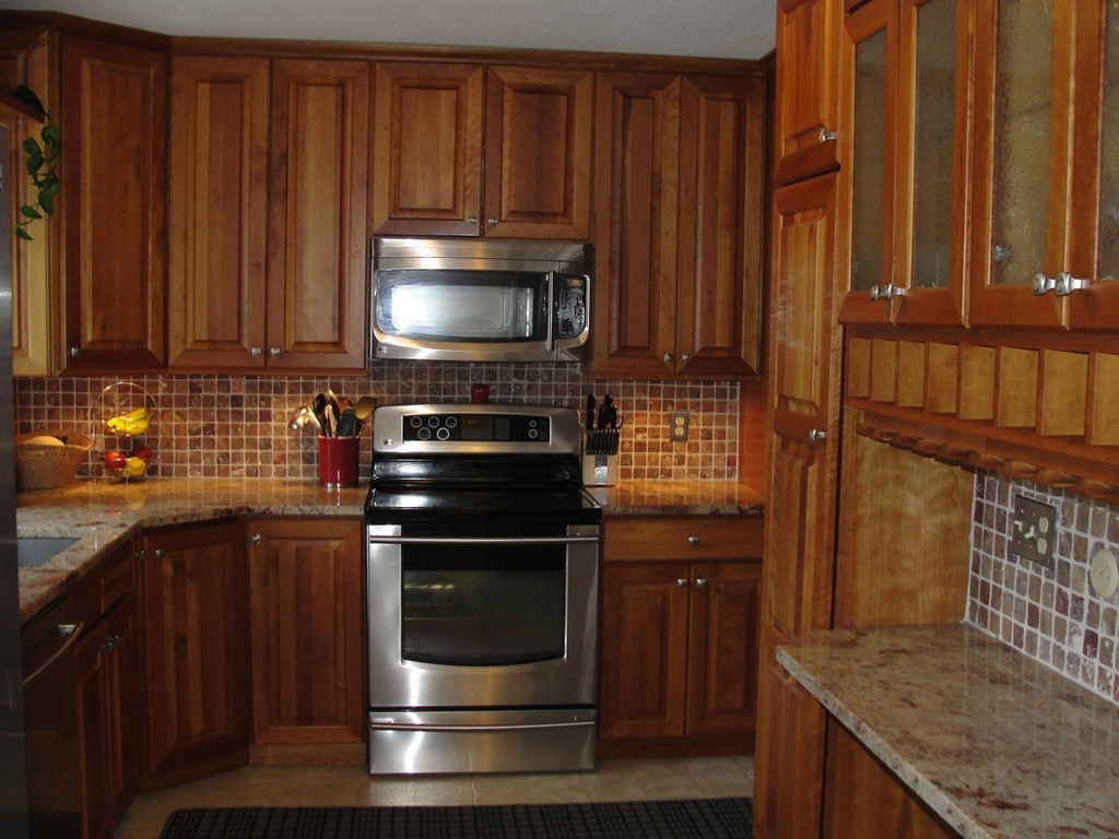 41 Allen Coit Road Huntington, MA 01050 - Photo 11 of 30 a kitchen with wooden cabinets and a stove top oven