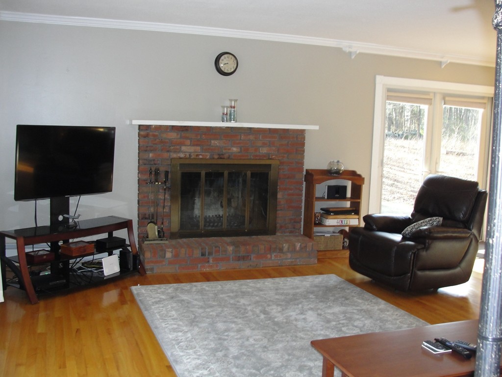 41 Allen Coit Road Huntington, MA 01050 - Photo 18 of 30 a living room with furniture and a fireplace