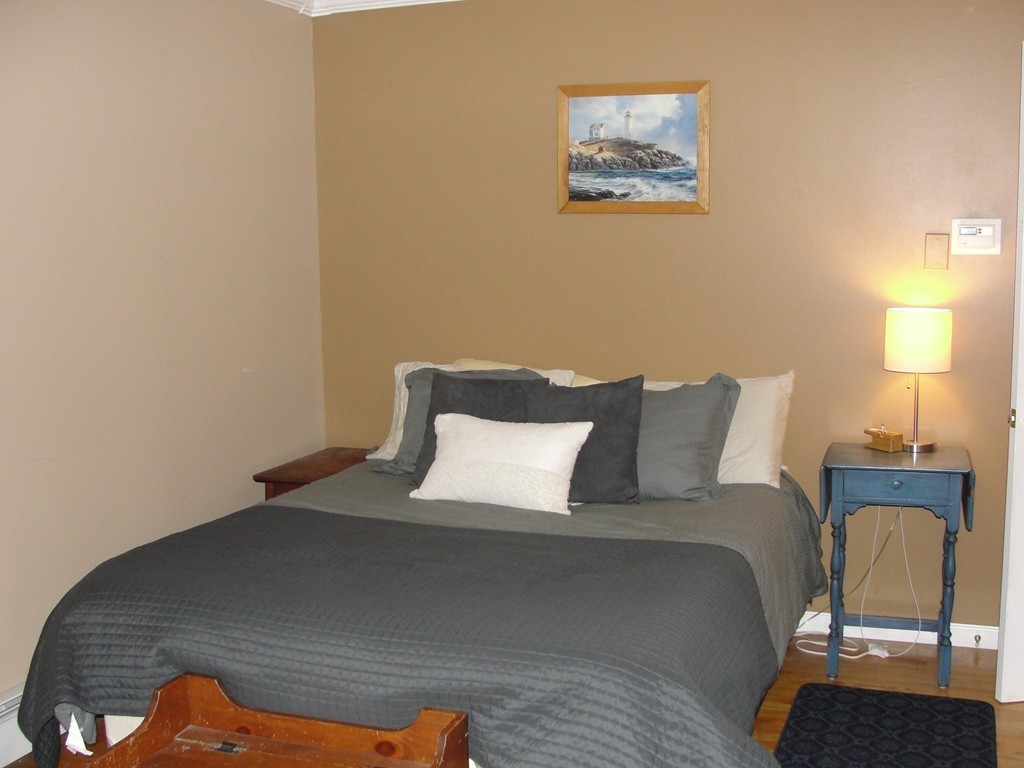 41 Allen Coit Road Huntington, MA 01050 - Photo 21 of 30 a bed room with a bed and a lamp