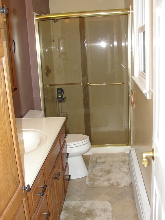 41 Allen Coit Road Huntington, MA 01050 - Photo 27 of 30 a bathroom with a sink a toilet and shower