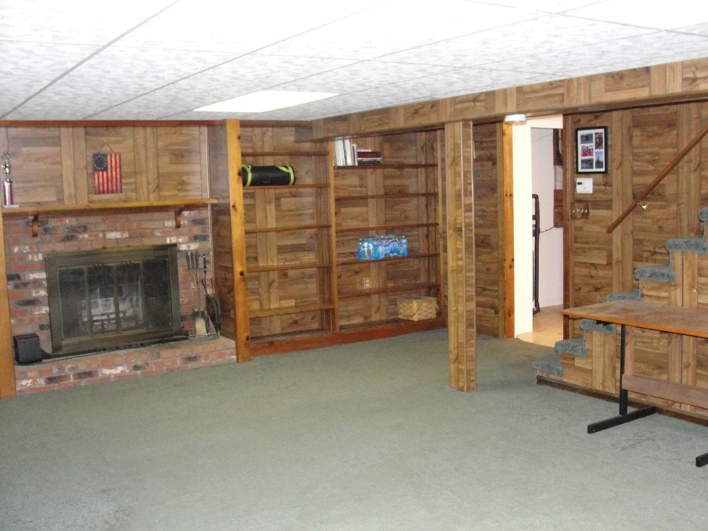 41 Allen Coit Road Huntington, MA 01050 - Photo 30 of 30 a view of an empty room with furniture and a fireplace