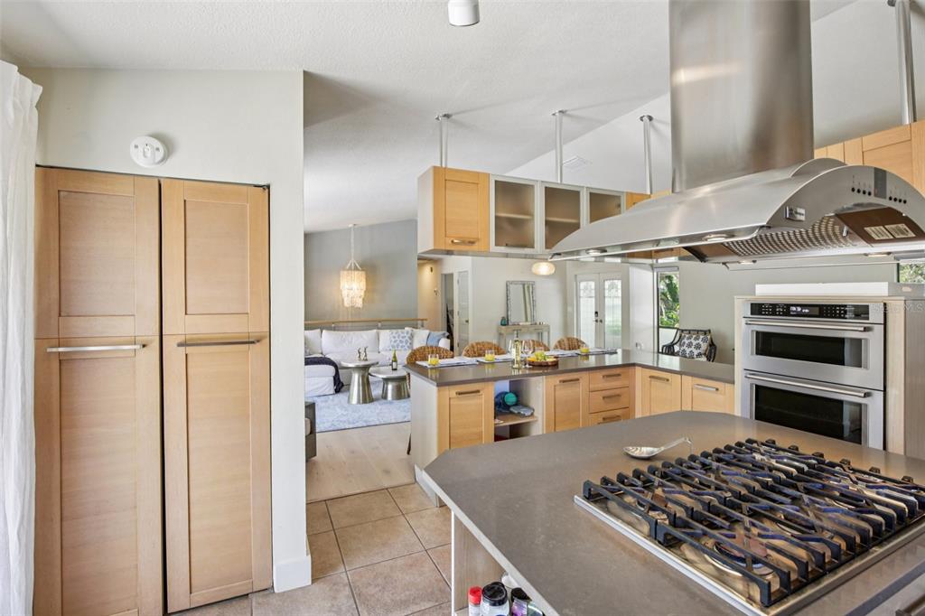 3390 Bayou Sound Longboat Key, FL 34228 - Photo 20 of 59 a large kitchen with stainless steel appliances granite countertop a stove and a refrigerator