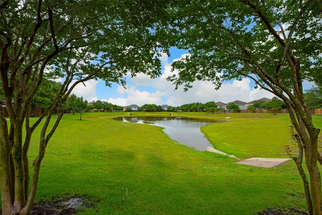 a view of a lake with a big yard