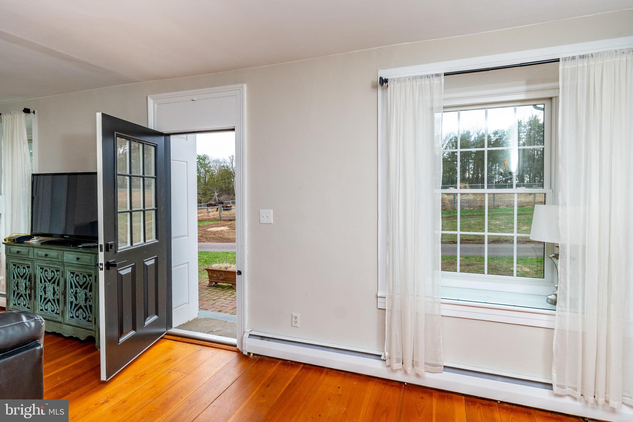 180 Municipal Road Pipersville, PA 18947 - Photo 15 of 60 Living Rm has two Doors leading to the Outside