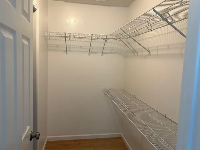 a view of a room with racks on the wall