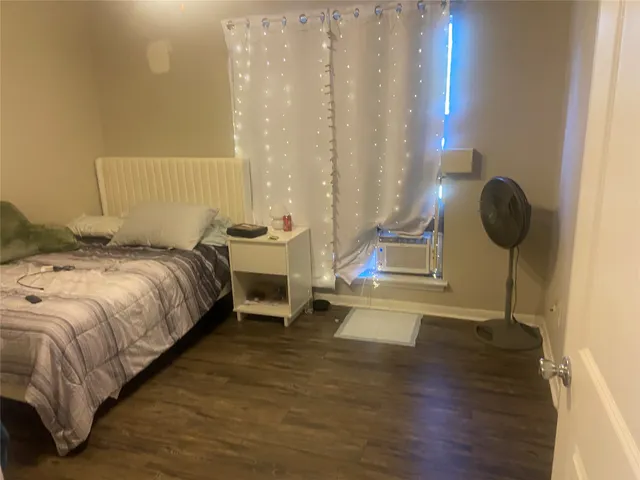 a bedroom with a bed and cabinets