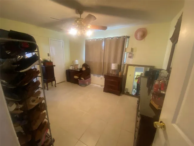 a living room with furniture and a mirror