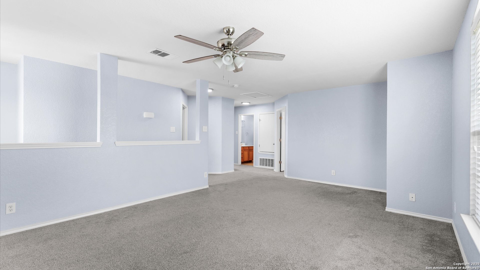 2744 Sterling Way Schertz, TX 78108 - Photo 11 of 22 an empty room with ceiling fan and windows