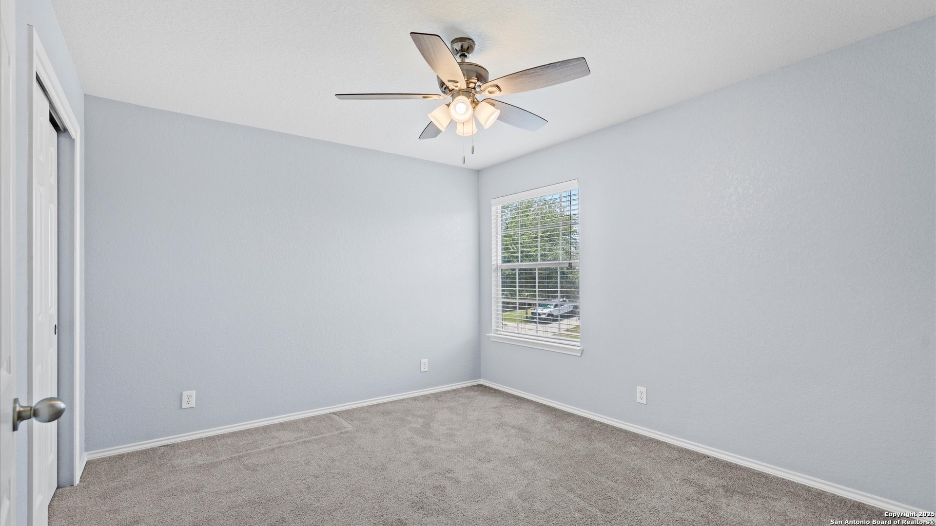 2744 Sterling Way Schertz, TX 78108 - Photo 12 of 22 an empty room with window and ceiling fan