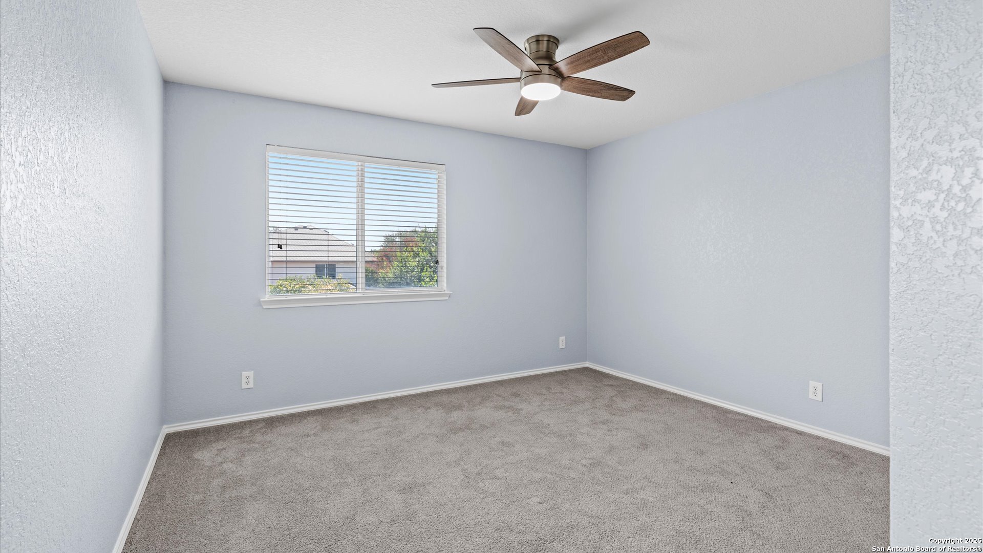 2744 Sterling Way Schertz, TX 78108 - Photo 13 of 22 an empty room with a window and a fan
