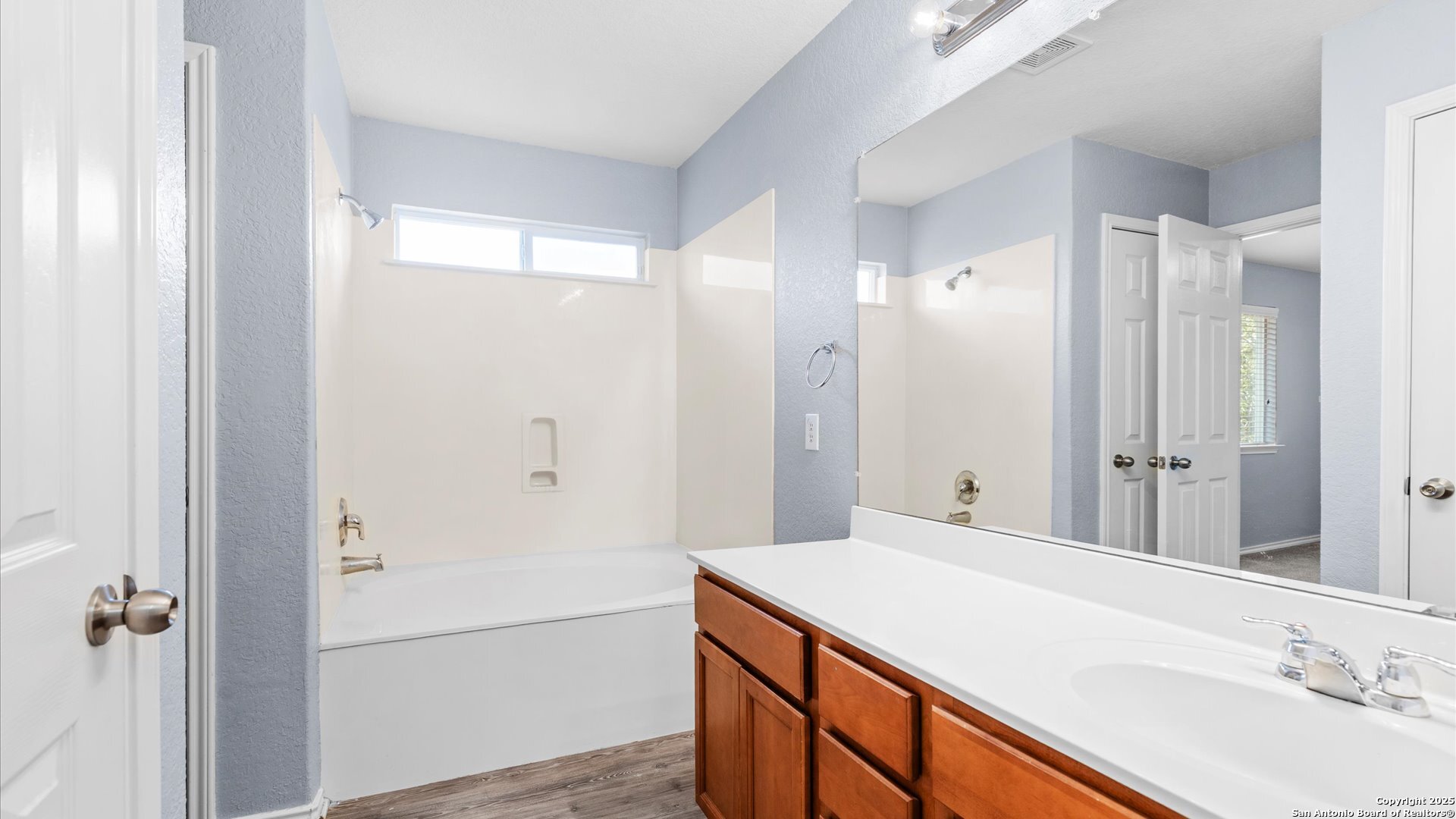 2744 Sterling Way Schertz, TX 78108 - Photo 17 of 22 a bathroom with a sink and a mirror