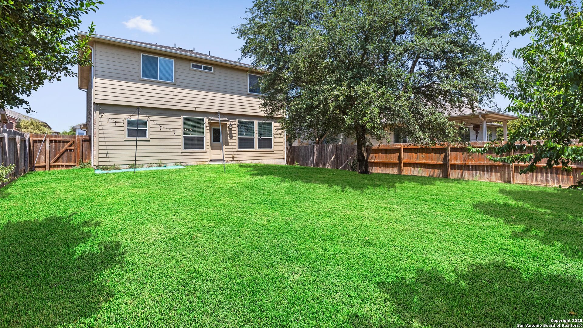 2744 Sterling Way Schertz, TX 78108 - Photo 18 of 22 a view of a house with a yard and sitting area