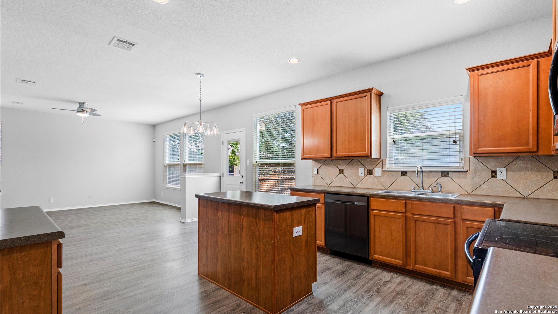 2744 Sterling Way Schertz, TX 78108 - Photo 5 of 22 a kitchen with sink a window and chairs