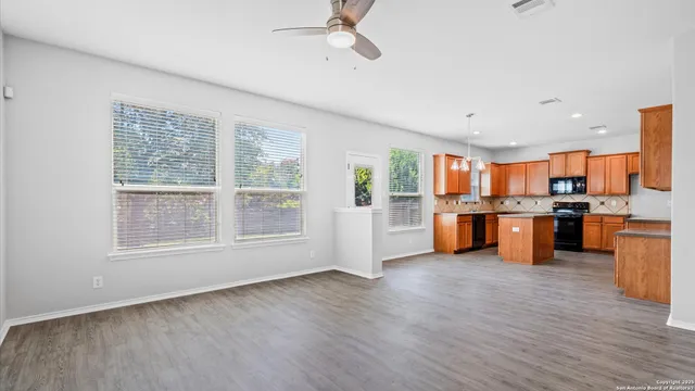 a view of kitchen with furniture and wooden floor