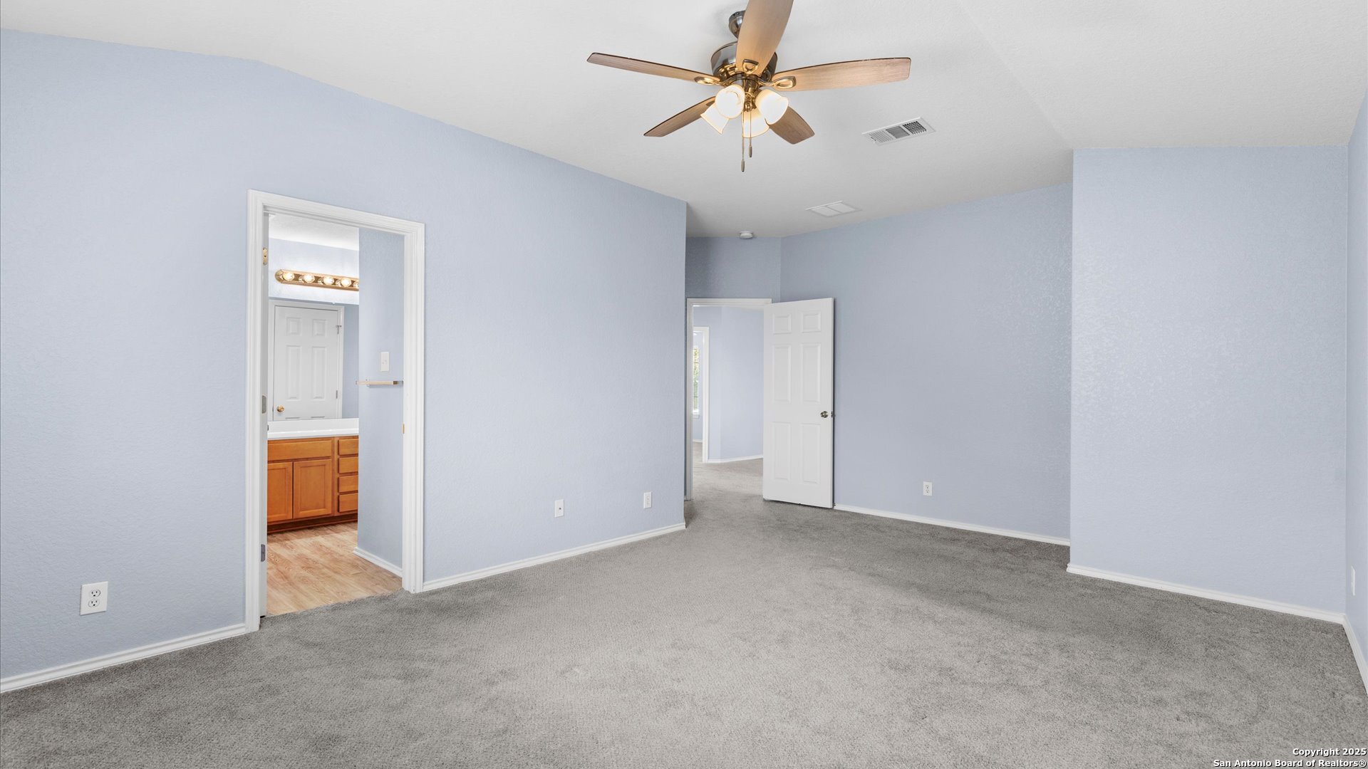 2744 Sterling Way Schertz, TX 78108 - Photo 10 of 22 a view of an empty room and a ceiling fan