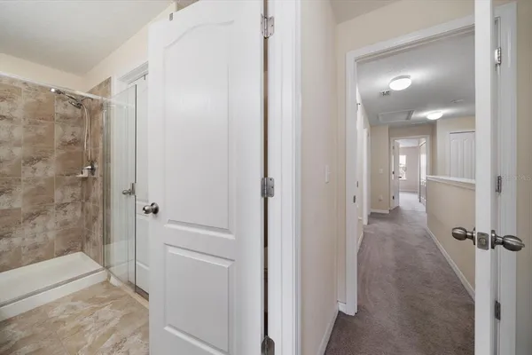 a view of a bathroom from the hallway