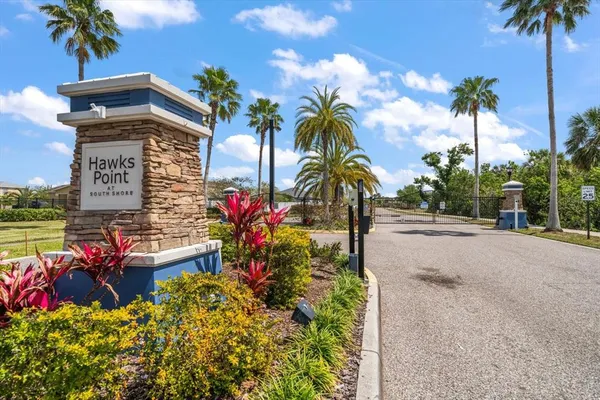 a view of a street with a palm trees