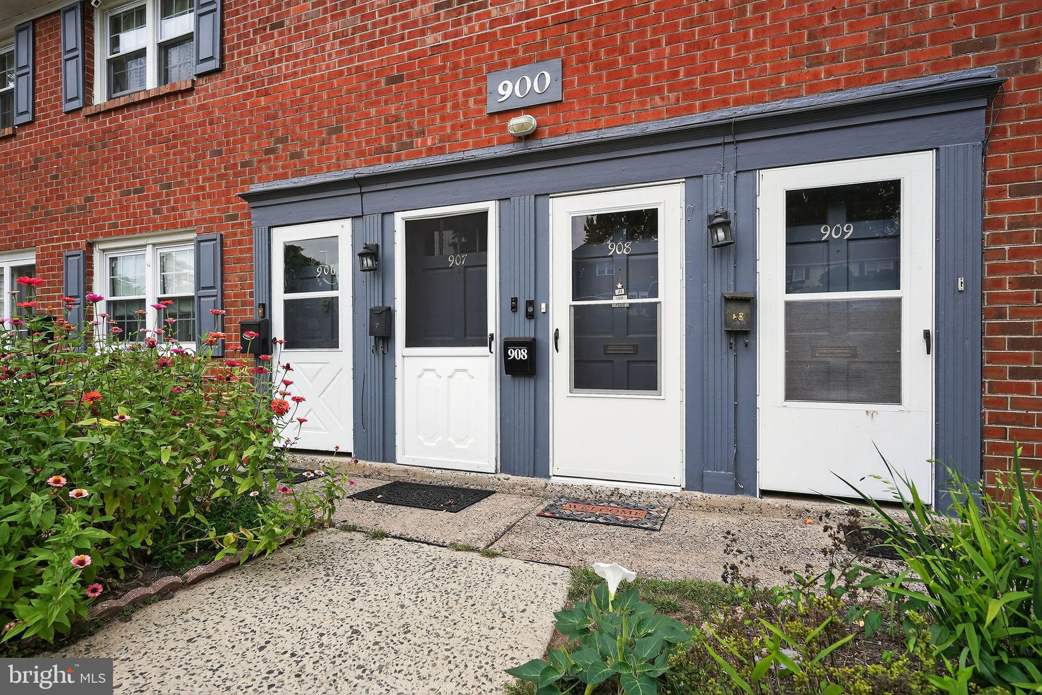908 Yardley Commons Yardley, PA 19067 - Photo 20 of 28 a front view of a house with a garden