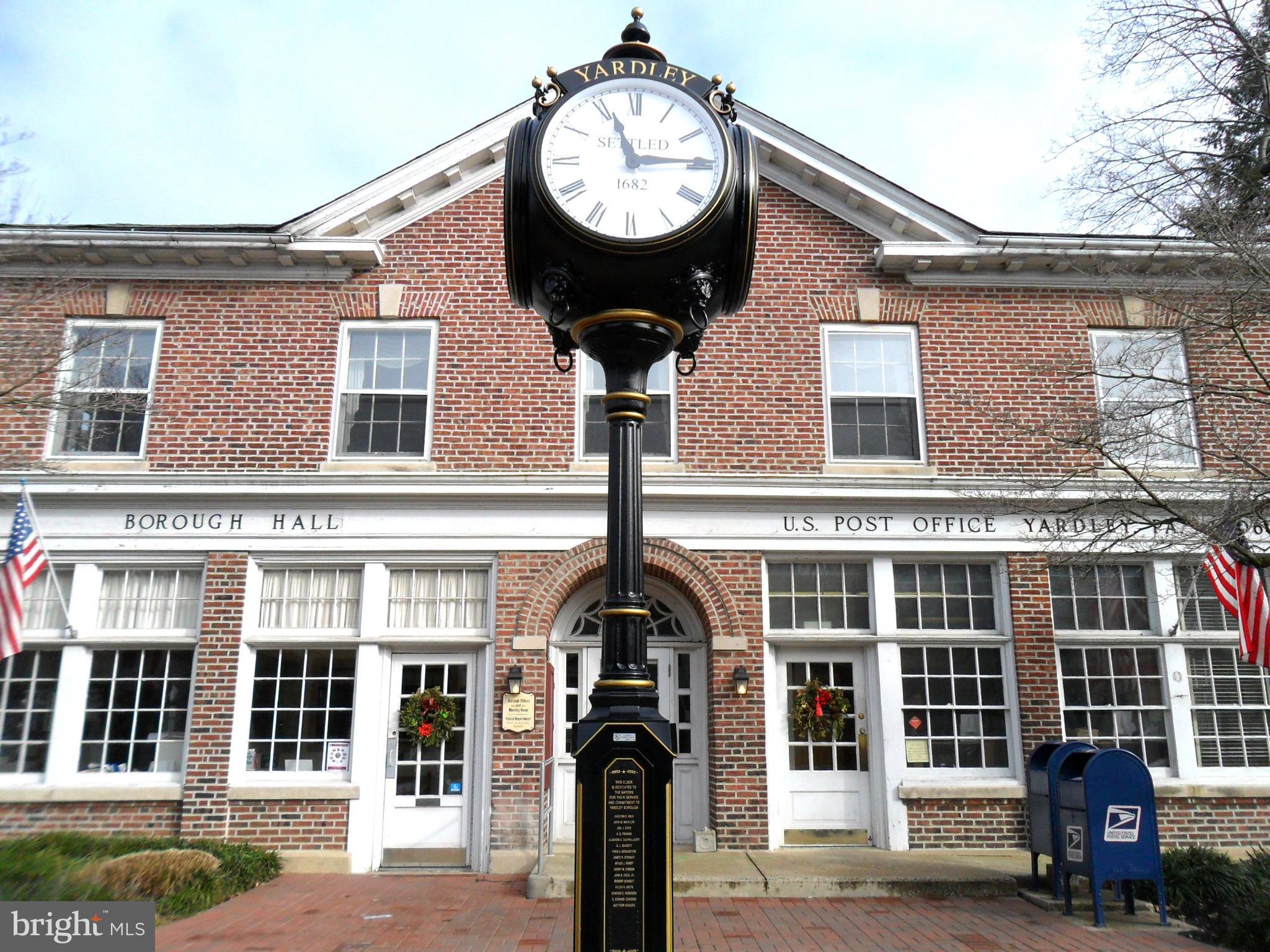 908 Yardley Commons Yardley, PA 19067 - Photo 27 of 28 front view of a brick house with a large windows