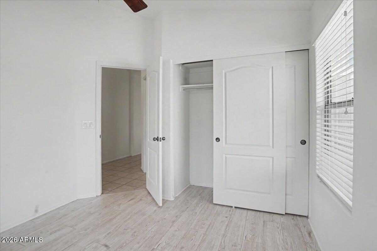 24726 North 29th Place Phoenix, AZ 85024 - Photo 11 of 31 a view of an empty room with closet and a window