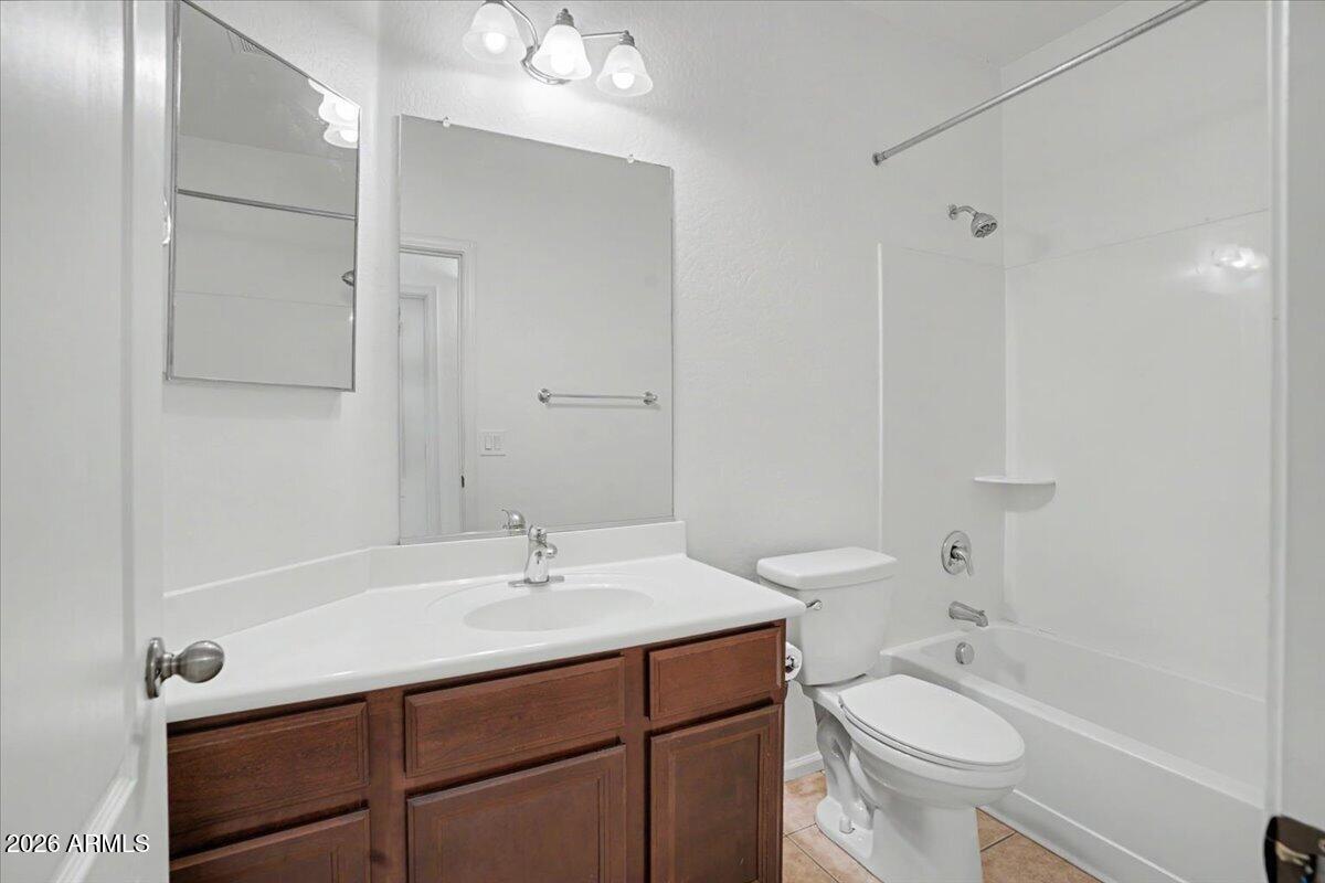 24726 North 29th Place Phoenix, AZ 85024 - Photo 13 of 31 a bathroom with a sink toilet a mirror and shower