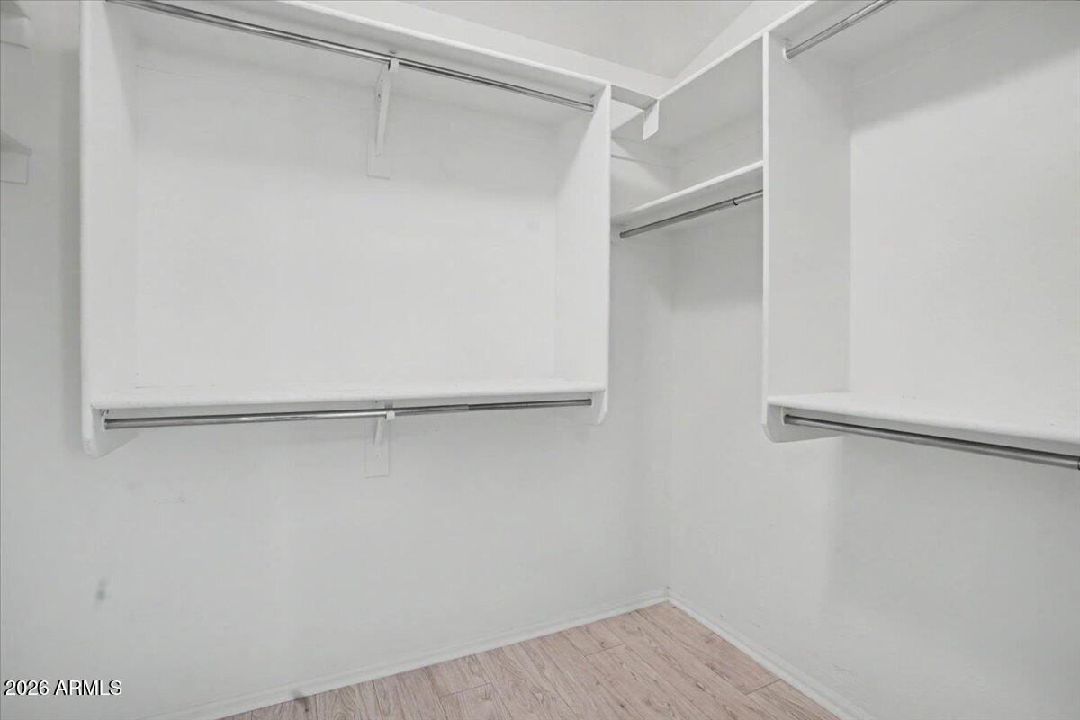 24726 North 29th Place Phoenix, AZ 85024 - Photo 17 of 31 a view of an empty walk in closet