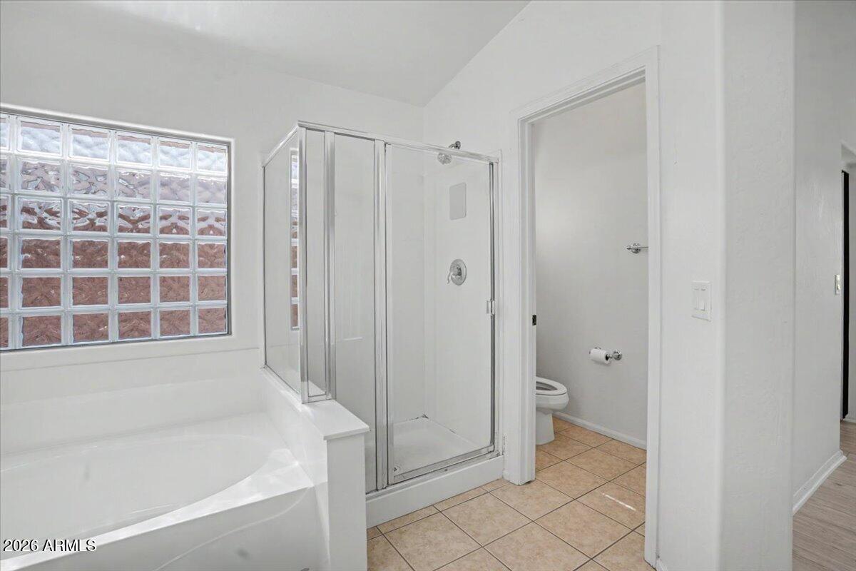 24726 North 29th Place Phoenix, AZ 85024 - Photo 19 of 31 a bathroom with a bathtub and a shower