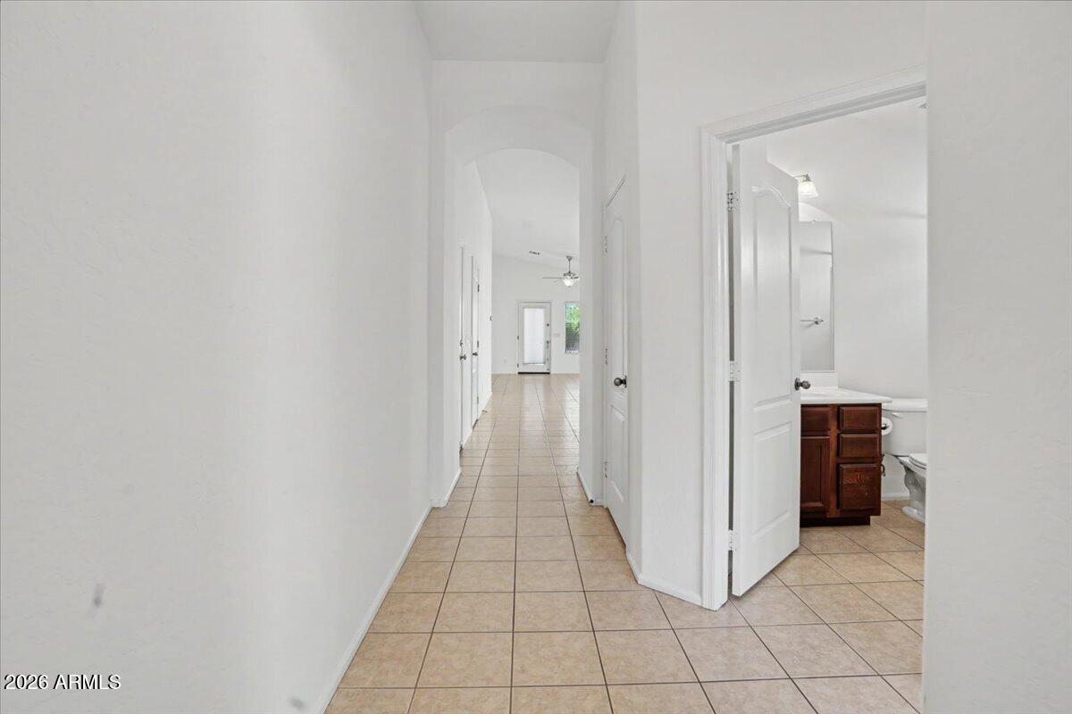 24726 North 29th Place Phoenix, AZ 85024 - Photo 2 of 31 a view of a hallway with closet and a bathroom