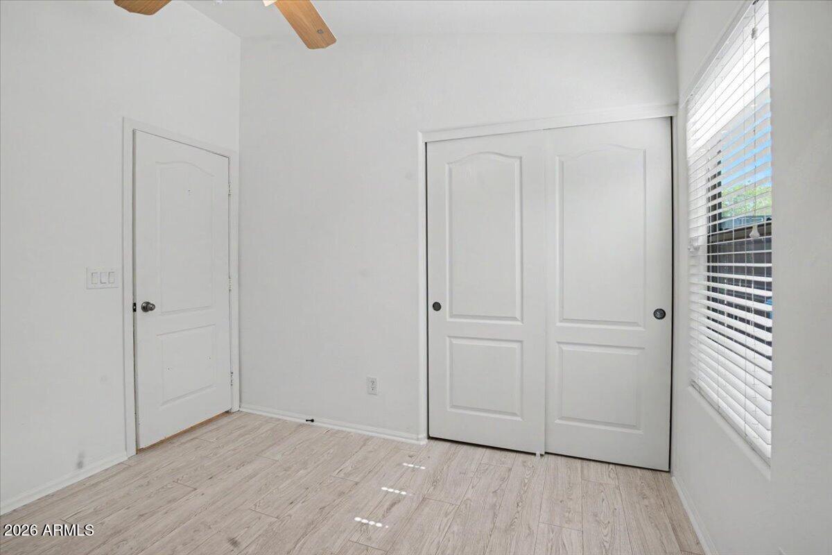 24726 North 29th Place Phoenix, AZ 85024 - Photo 22 of 31 a view of an empty room and wooden floor