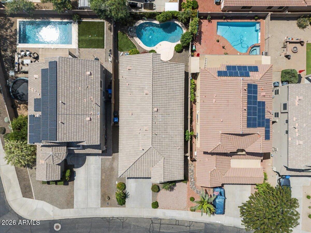 24726 North 29th Place Phoenix, AZ 85024 - Photo 29 of 31 aerial view of a house with a fountain and a potted plant
