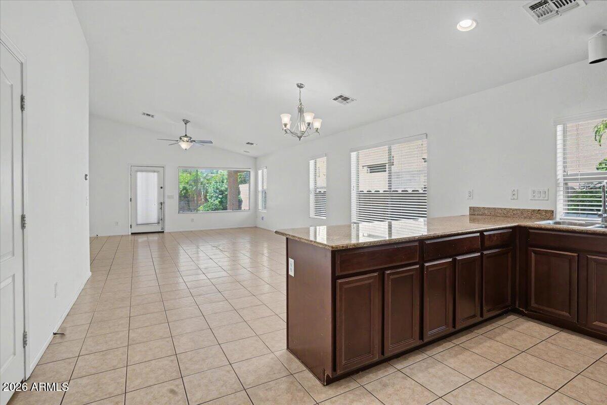 24726 North 29th Place Phoenix, AZ 85024 - Photo 9 of 31 a kitchen with a sink and cabinets