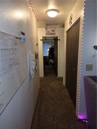 a view of a hallway with elevator