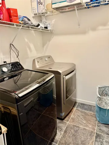 a stove top oven sitting inside of a kitchen
