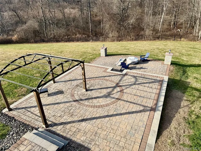 a view of a swimming pool with a patio and swimming pool
