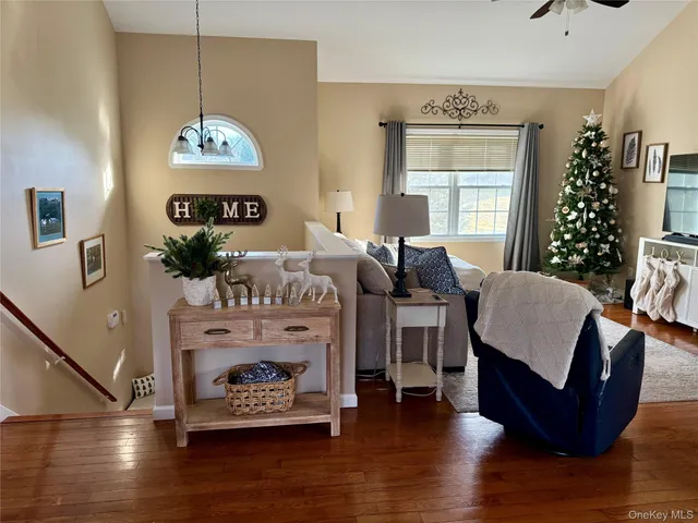 a living room with furniture a dining table with wooden floor
