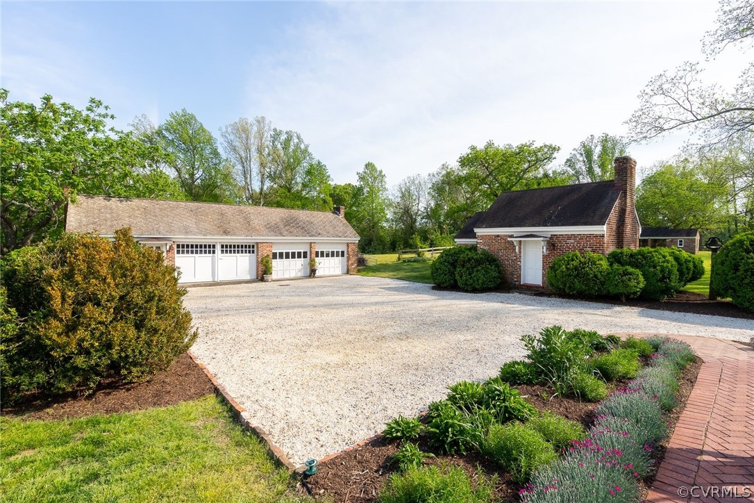 1273 North Point Farm Road King William, VA 23086 - Photo 9 of 47 a view of a house with a yard and potted plants