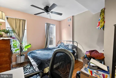 a bed room with a bed and a chair