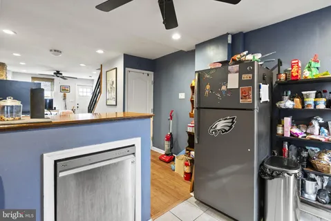 a view of open kitchen with a refrigerator and a refrigerator