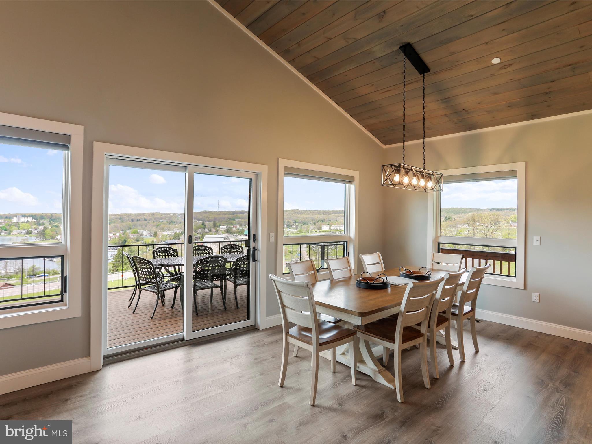 215 Fair Gate Road McHenry, MD 21541 - Photo 11 of 52 a view of a dining room with furniture window and wooden floor