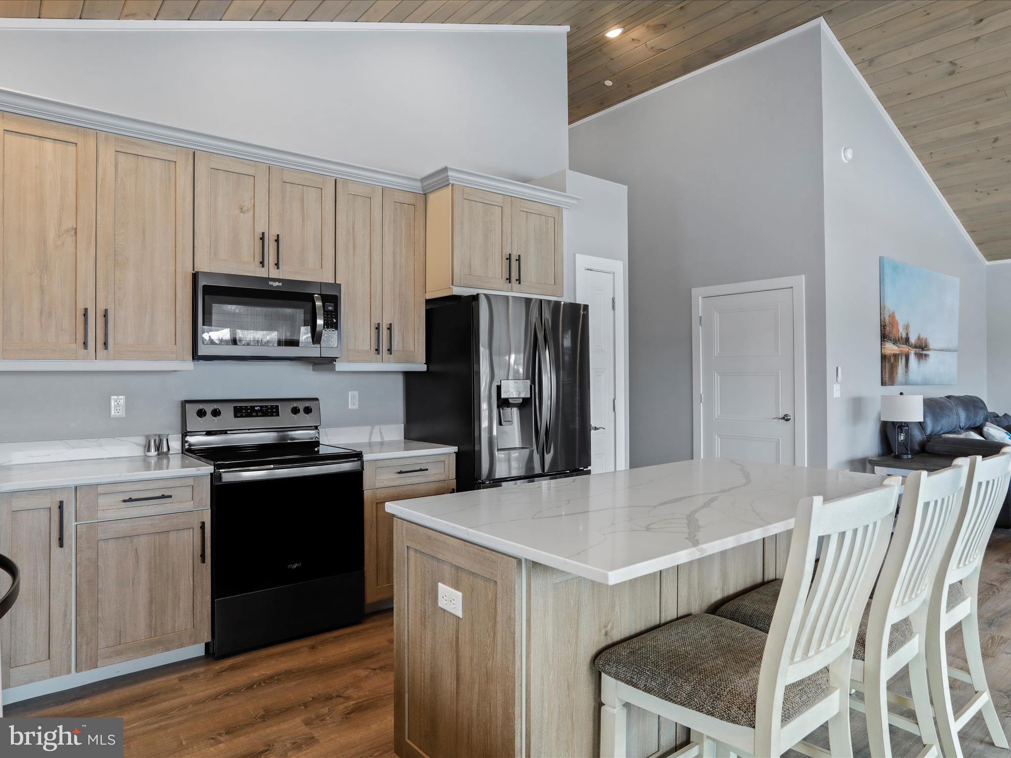 215 Fair Gate Road McHenry, MD 21541 - Photo 14 of 52 a kitchen with a stove a sink and a refrigerator