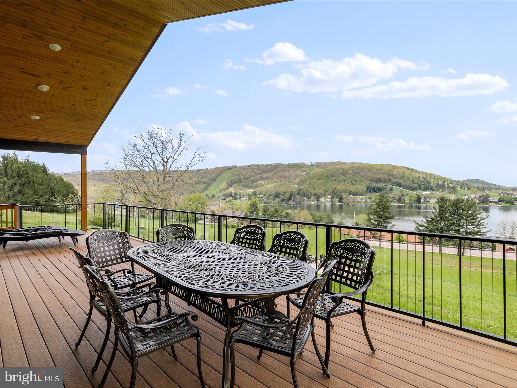 215 Fair Gate Road McHenry, MD 21541 - Photo 22 of 52 an outdoor view from a balcony with seating space