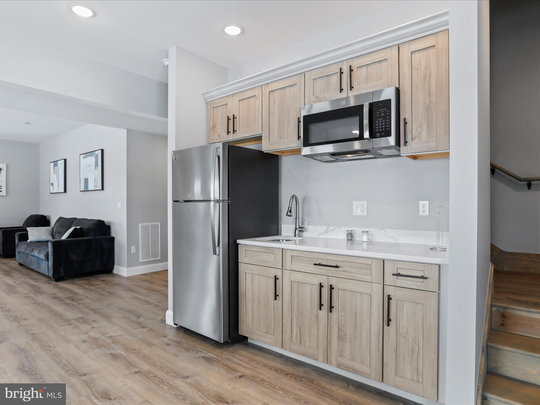 215 Fair Gate Road McHenry, MD 21541 - Photo 24 of 52 a kitchen with stainless steel appliances a refrigerator stove microwave and sink
