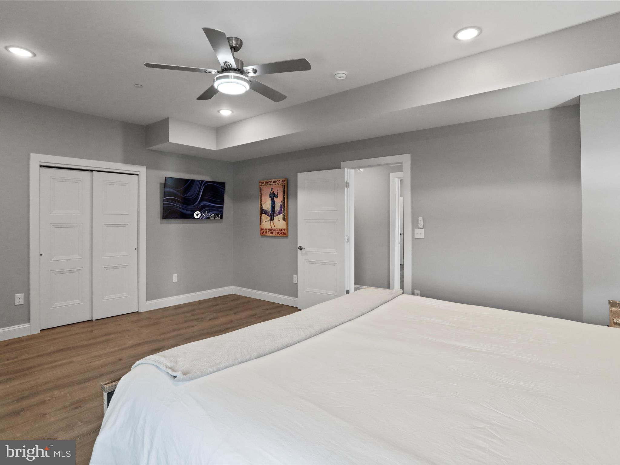 215 Fair Gate Road McHenry, MD 21541 - Photo 25 of 52 a bedroom with a large bed and a chandelier