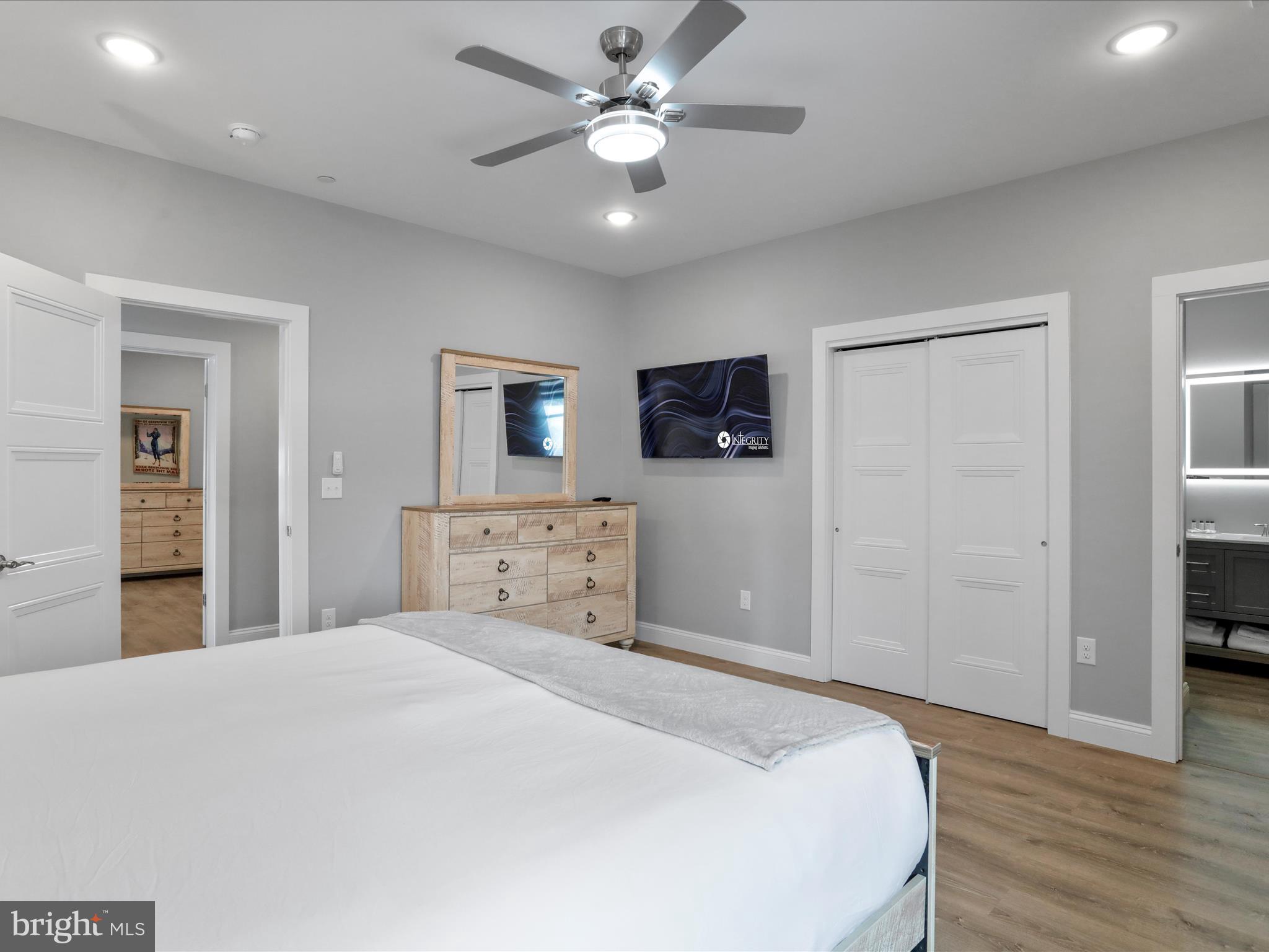 215 Fair Gate Road McHenry, MD 21541 - Photo 30 of 52 a bedroom with a bed and a chandelier