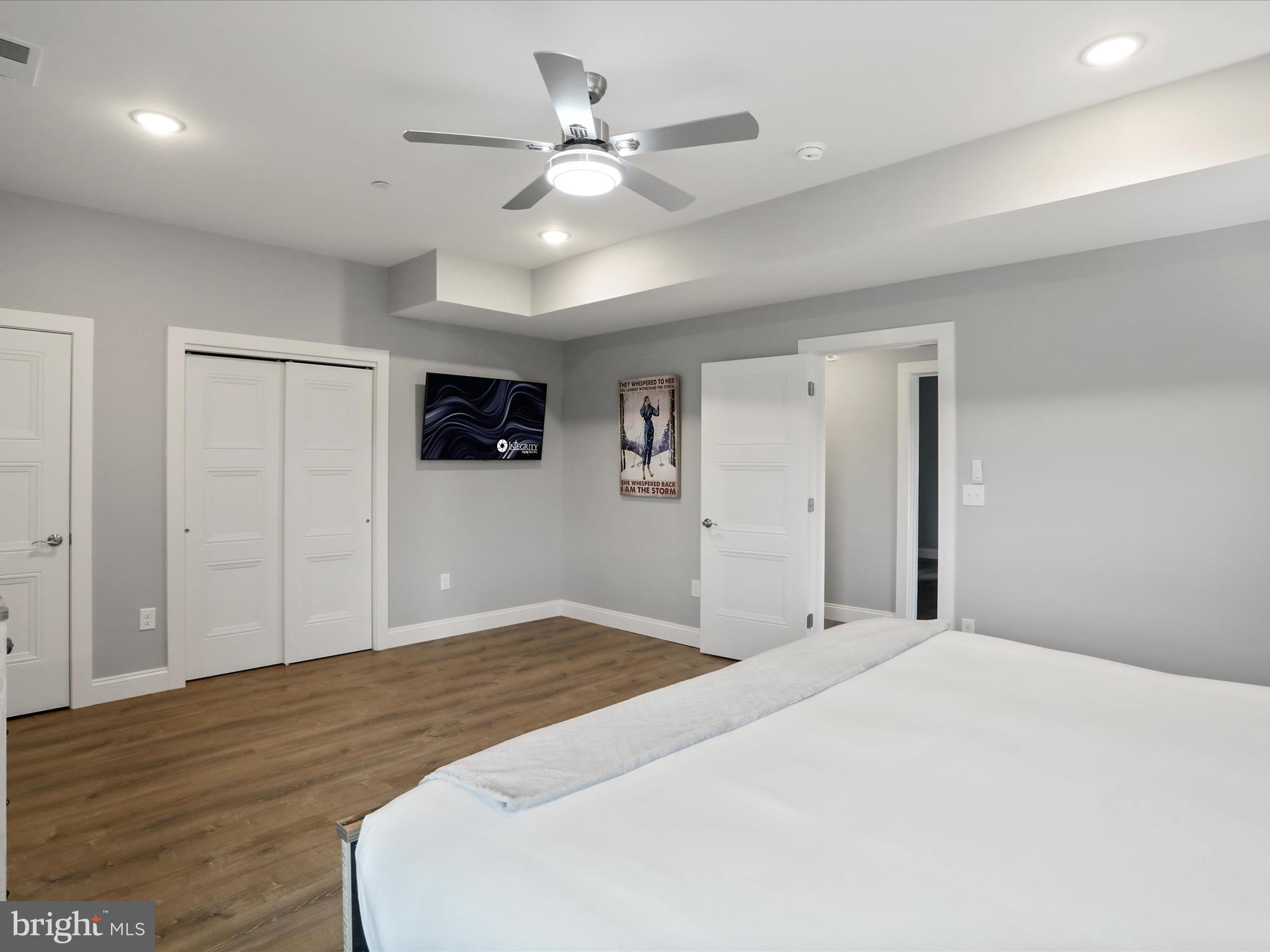 215 Fair Gate Road McHenry, MD 21541 - Photo 37 of 52 a bedroom with a large bed and a ceiling fan