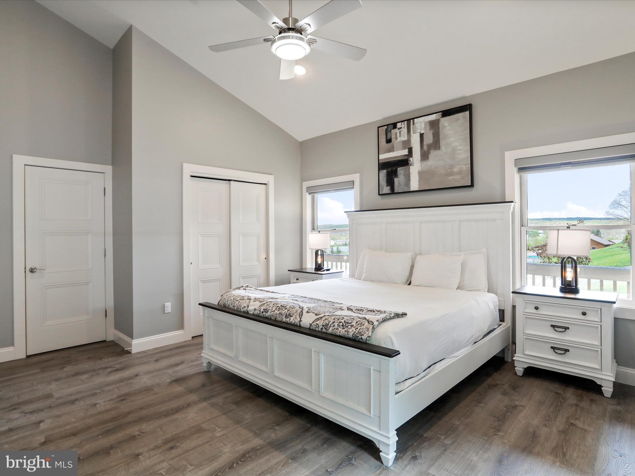 215 Fair Gate Road McHenry, MD 21541 - Photo 39 of 52 a bedroom with a bed and a chandelier