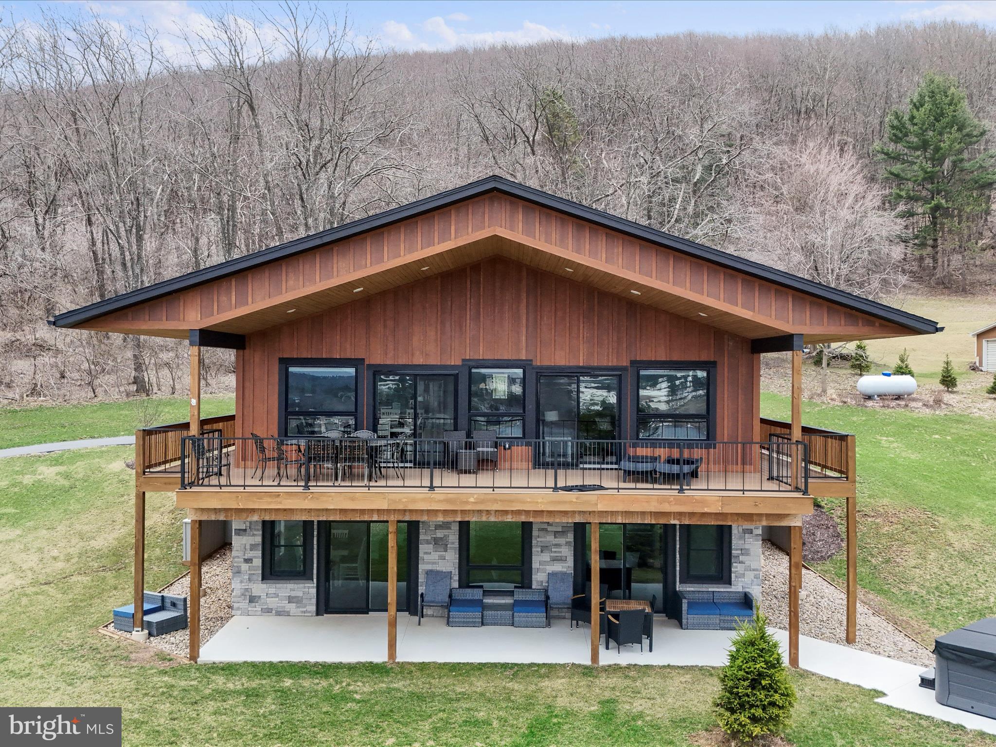 215 Fair Gate Road McHenry, MD 21541 - Photo 4 of 52 a view of a house with a yard porch and sitting area