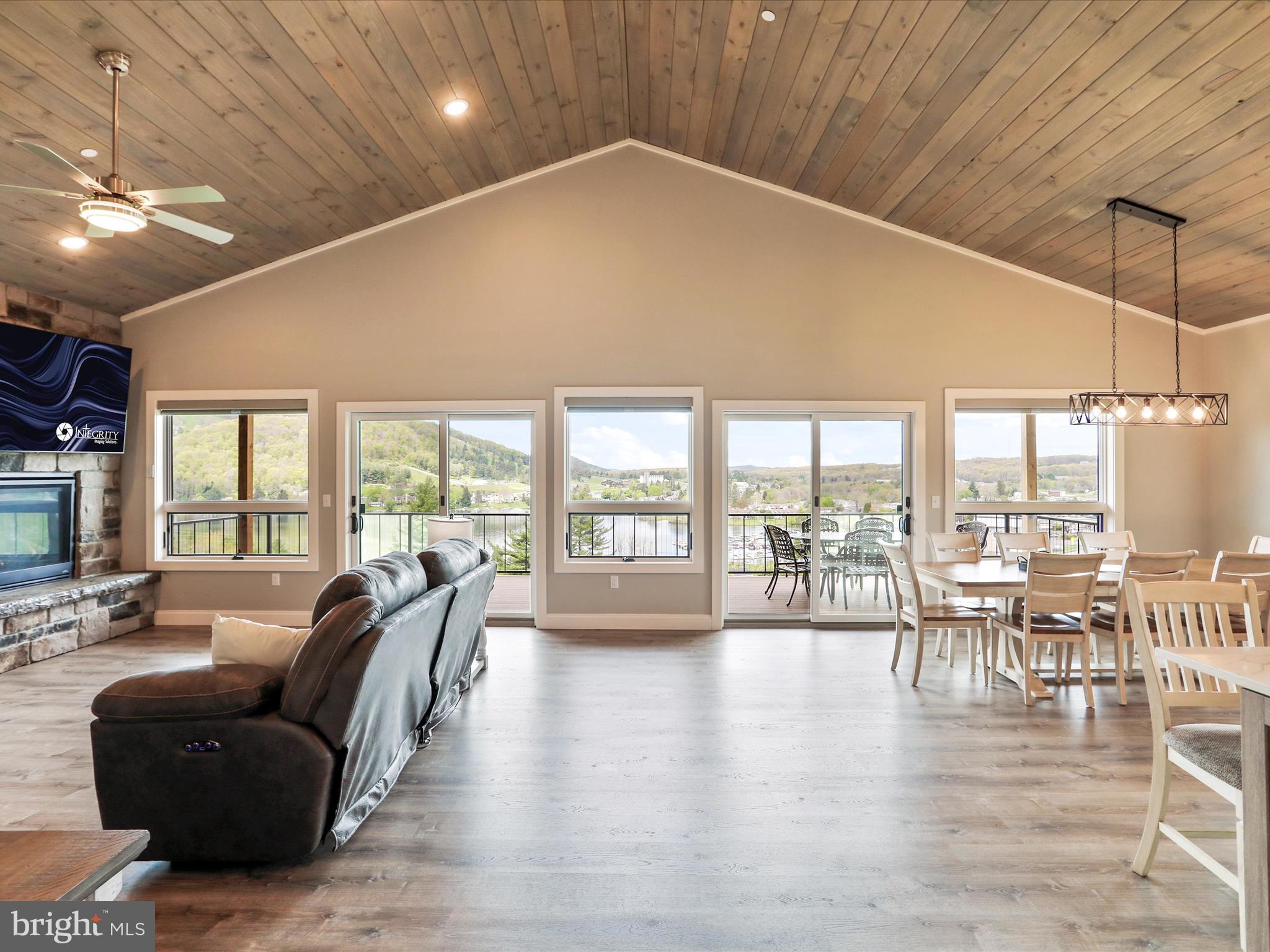215 Fair Gate Road McHenry, MD 21541 - Photo 5 of 52 a living room with furniture large windows and wooden floor