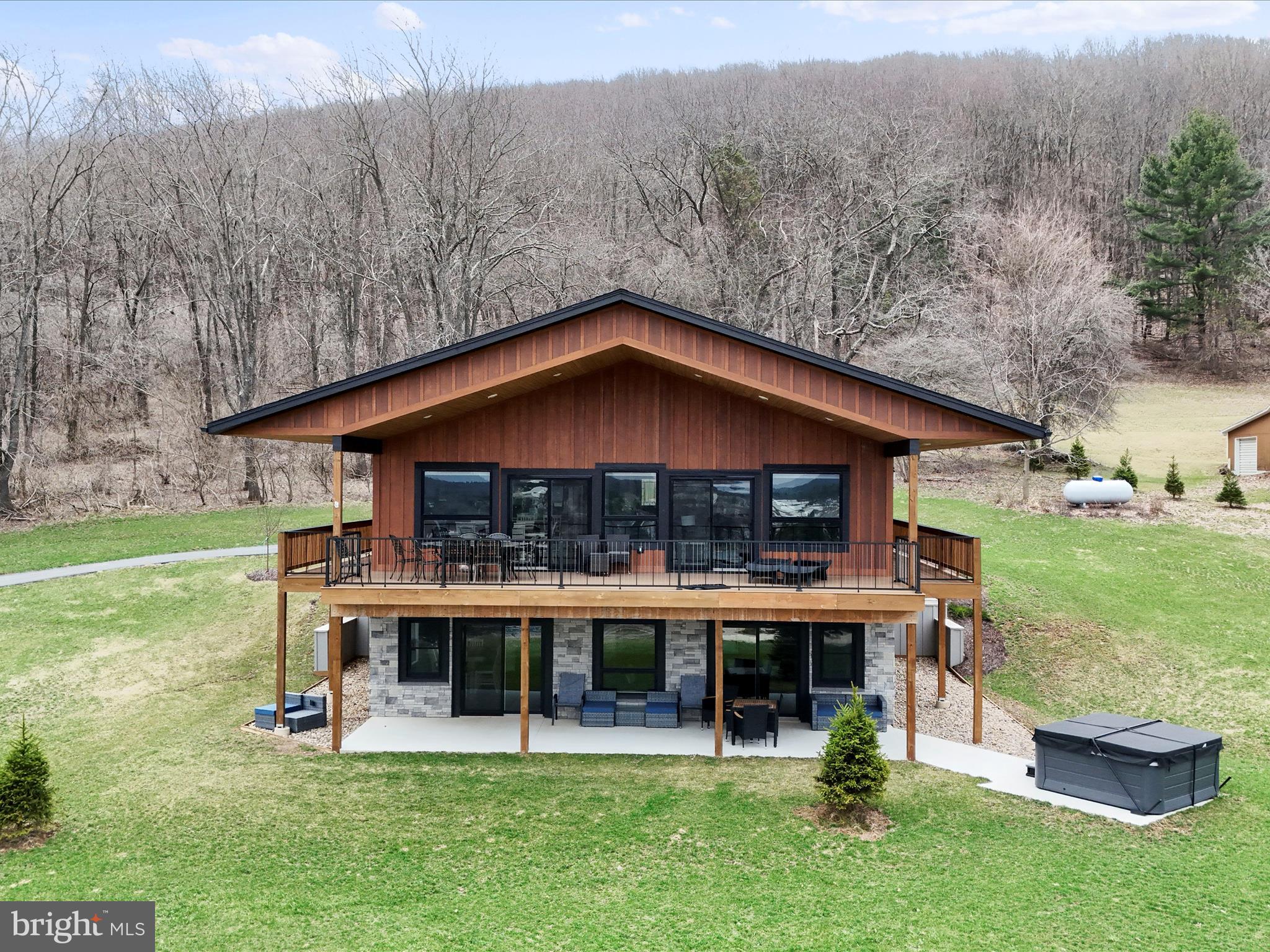 215 Fair Gate Road McHenry, MD 21541 - Photo 51 of 52 a view of a house with backyard porch and sitting area