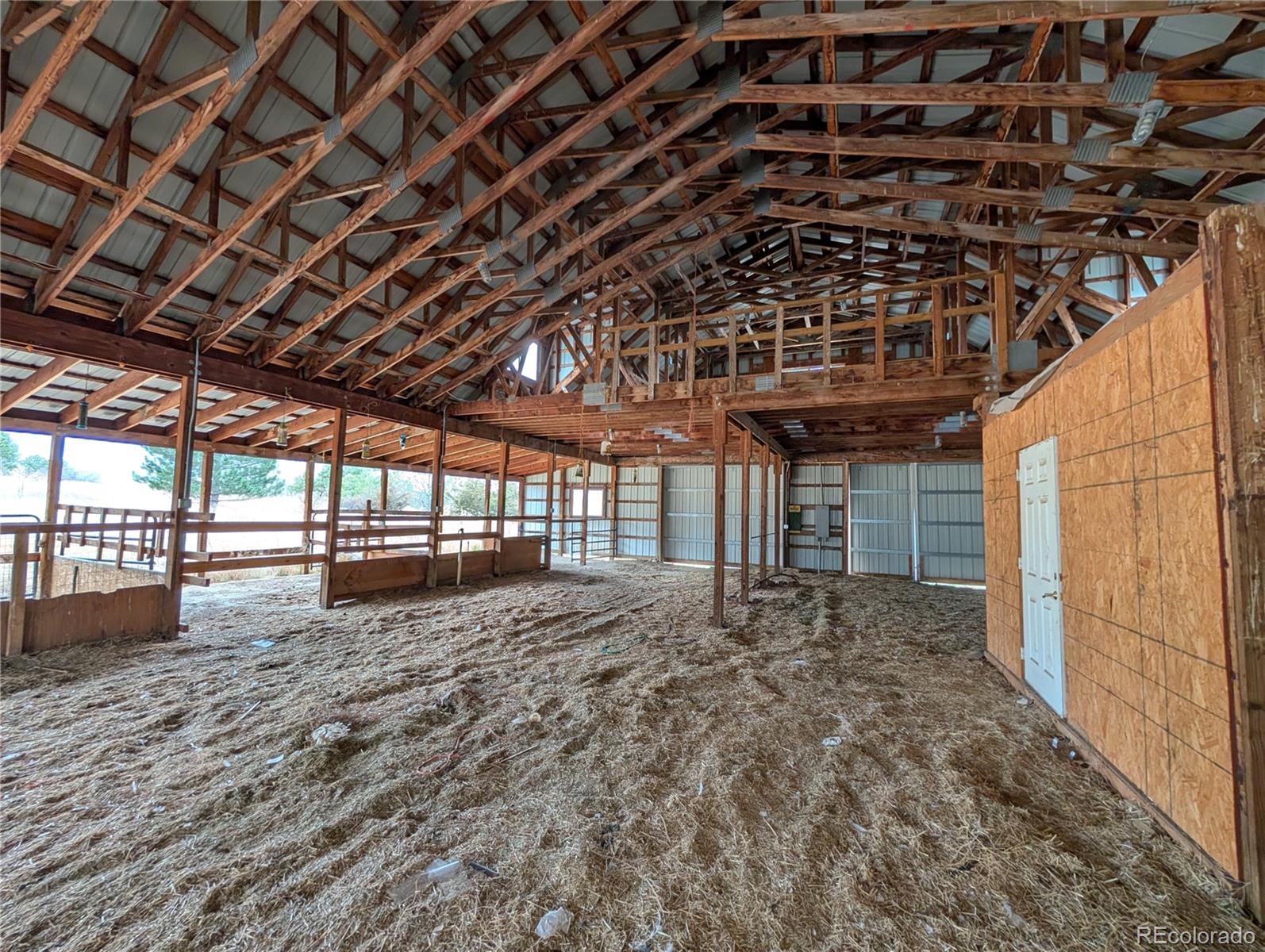 43882 Buckskin Road Parker, CO 80138 - Photo 14 of 19 a view of empty room with wooden floor